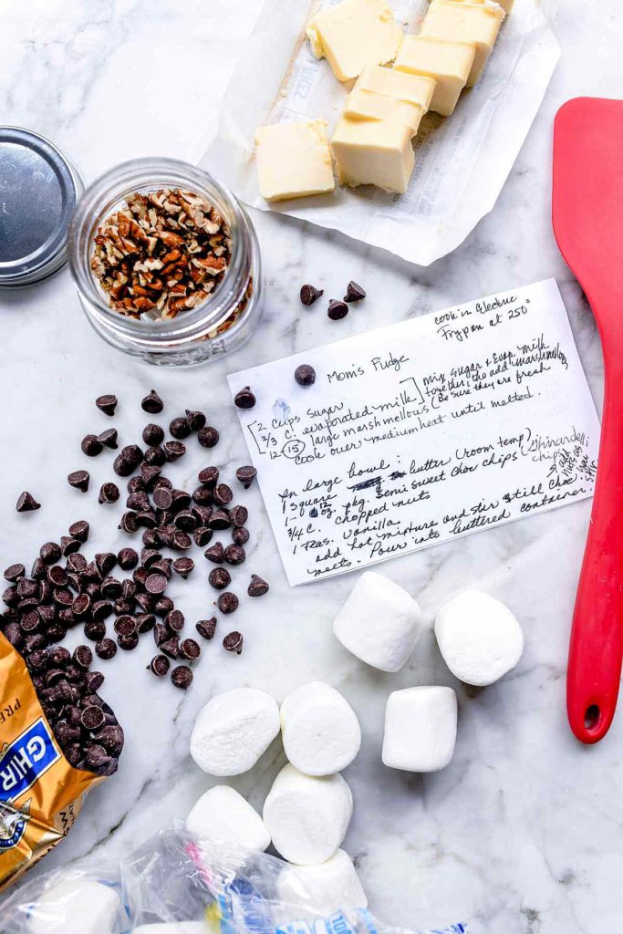 fudge recipe card on counter surrounded by fudge ingredients
