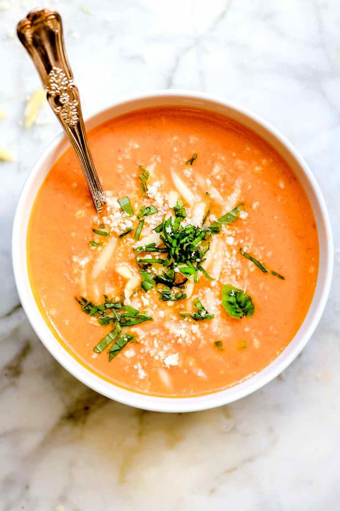 Tomato Basil Soup in white bowl with spoon