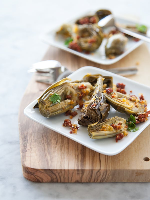 Roasted Artichoke with Chorizo Dressing | FoodieCrush.com