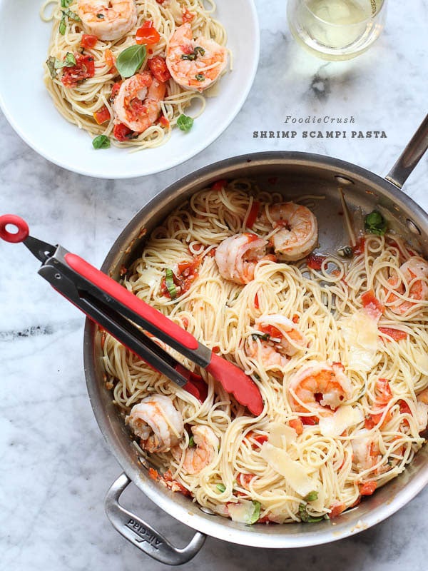 Shrimp Scampi Pasta in metal saucepan with tongs