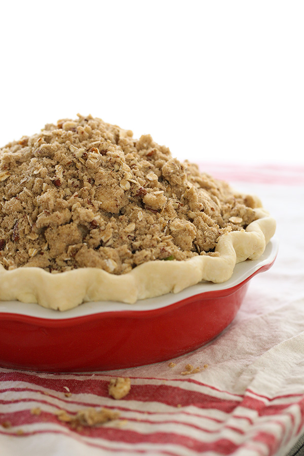 apple pie with crumb topping ready to be baked