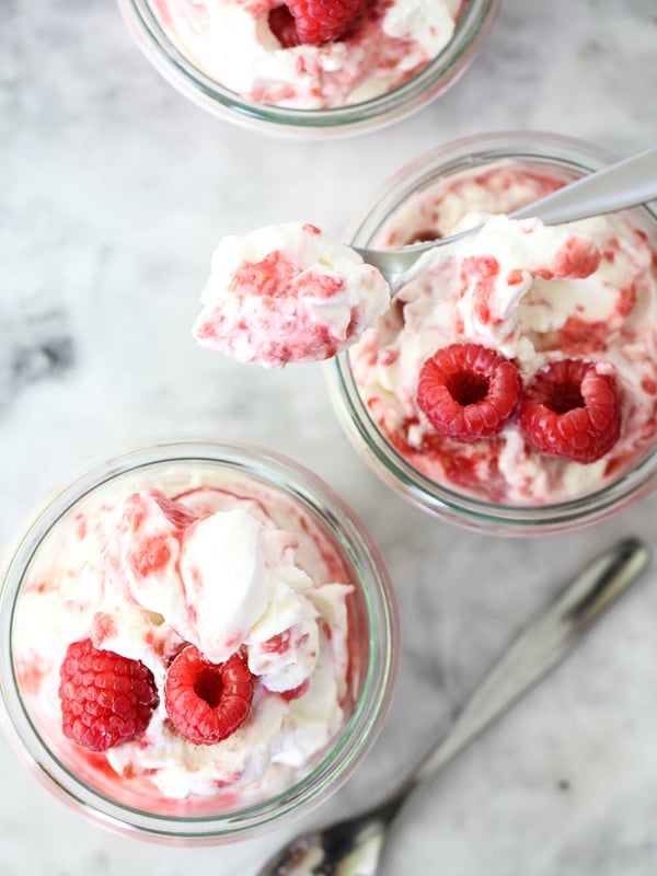 raspberry fool in two glass jars with spoons