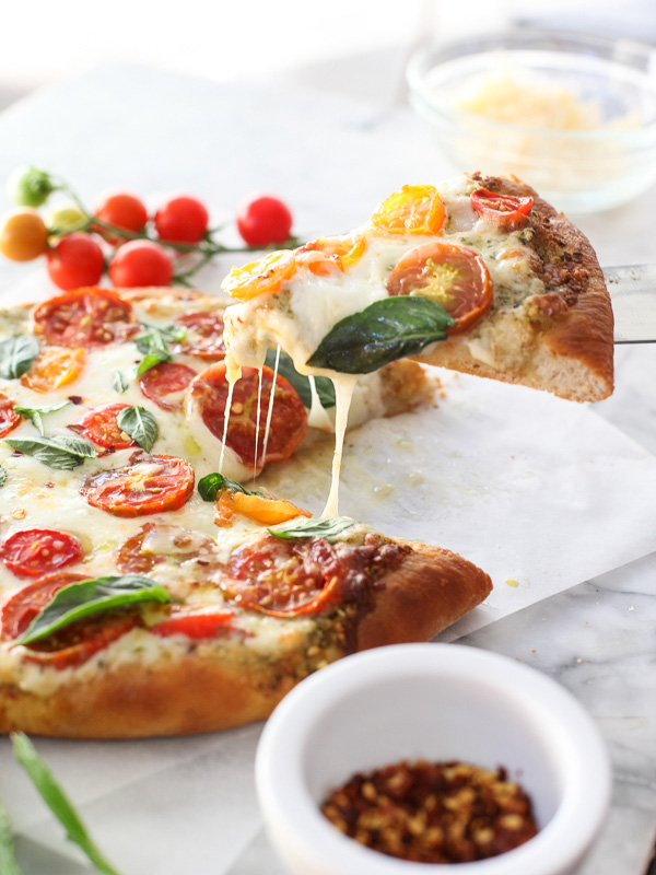 Pesto Pizza with Fresh Tomatoes and Mozzarella #recipe on foodiecrush.com 