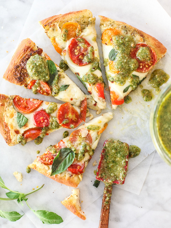 Pesto Pizza with Fresh Tomatoes and Mozzarella #recipe on foodiecrush.com