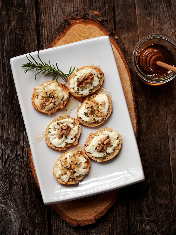 Warm Goat Cheese Toasts with Walnuts, Rosemary and Honey from seasonsandsuppers.ca on foodiecrush.com