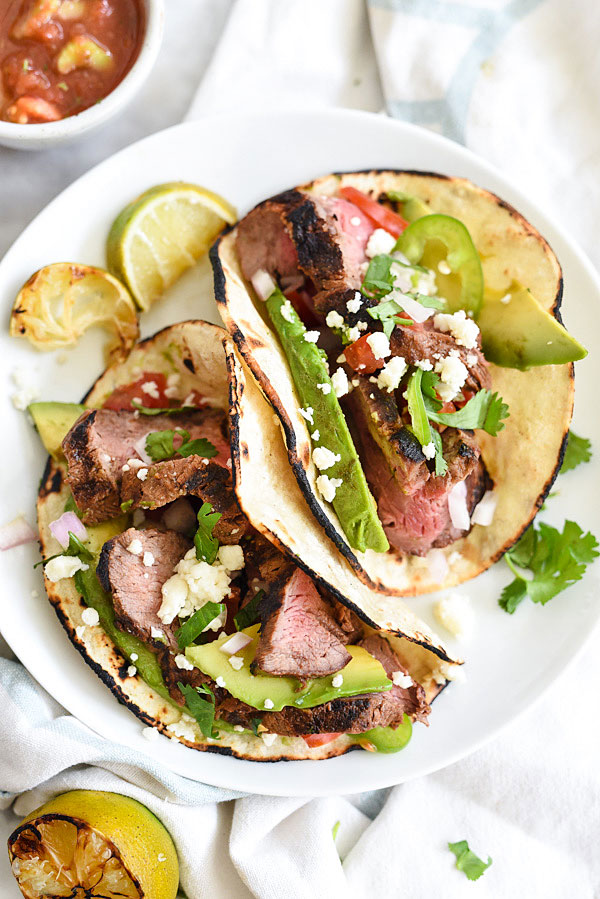 Grilled Steak Tacos marinated in a citrus adobo sauce for tons of flavor on foodiecrush.com 