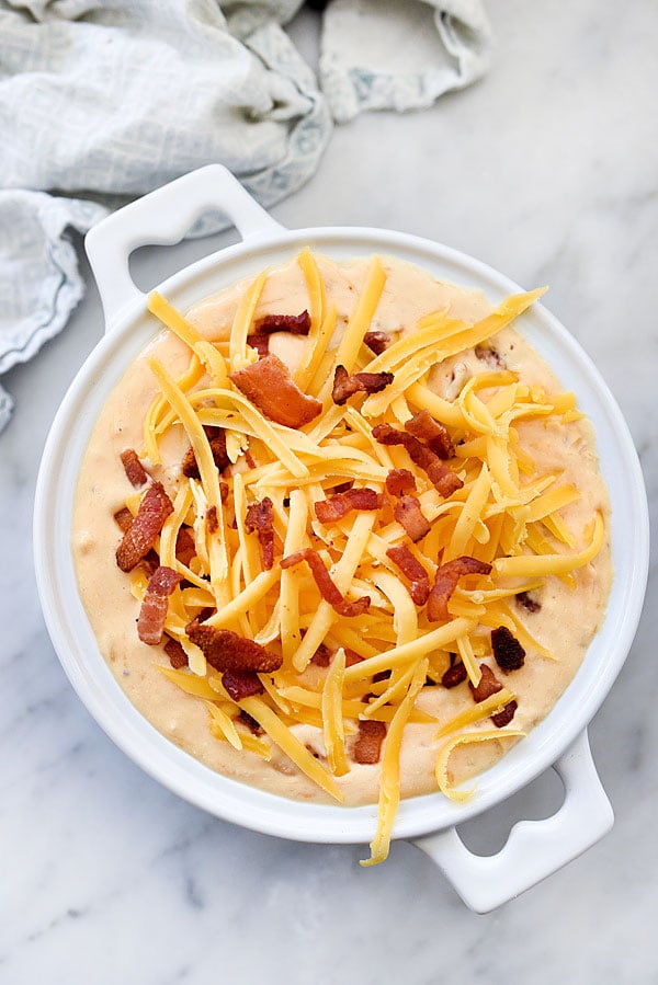 DIP IN! Bacon Beer Cheese Dip any man or woman will love foodiecrush.com #cheese #beer #dip #bacon #football #tailgating