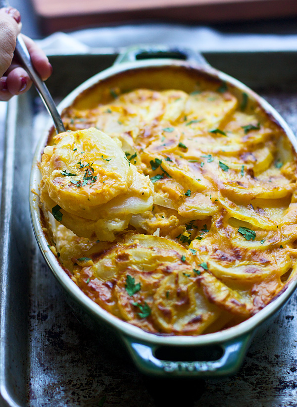 Creamy Pumpkin and Cheddar Scalloped Potatoes from Cooking for Keeps on foodiecrush.com 