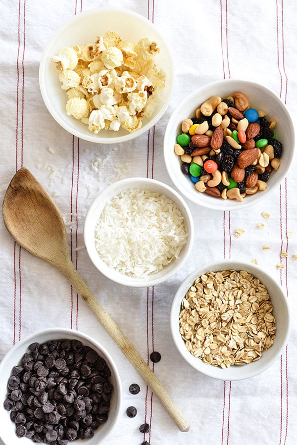 Loaded Monster Cookies pack in all the flavors with whole wheat pastry flour, nuts, oatmeal, and coconut. And don't forget the chocolate for a healthy twist on dessert | foodiecrush.com