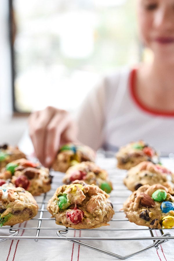 Loaded Monster Cookies pack in all the flavors with whole wheat pastry flour, nuts, oatmeal, popcorn, and coconut. And don't forget the chocolate for a healthy twist on dessert | foodiecrush.com