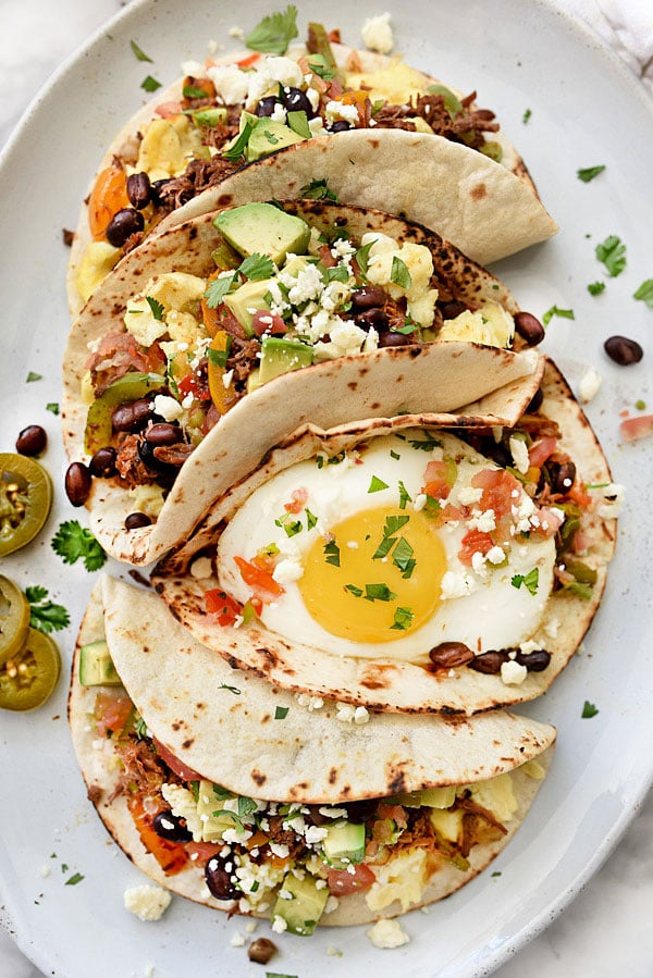 four Breakfast Tacos on white platter