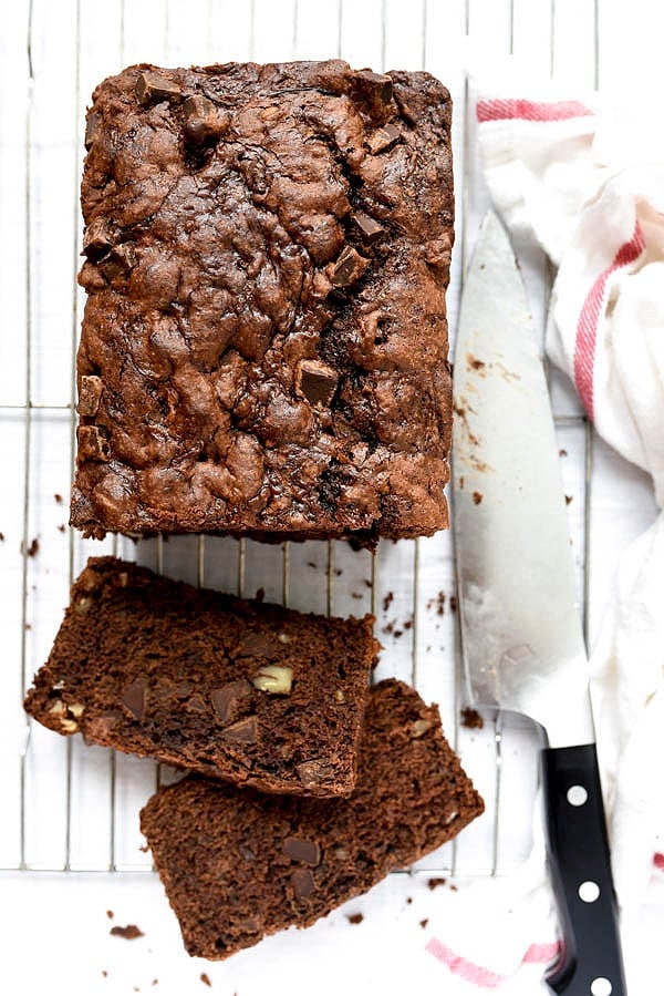 Double Chocolate Zucchini Bread loaf on wire rack with knife