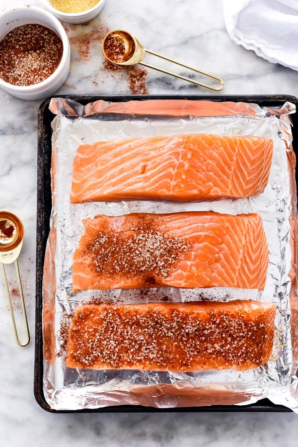 uncooked maple syrup salmon on baking tray
