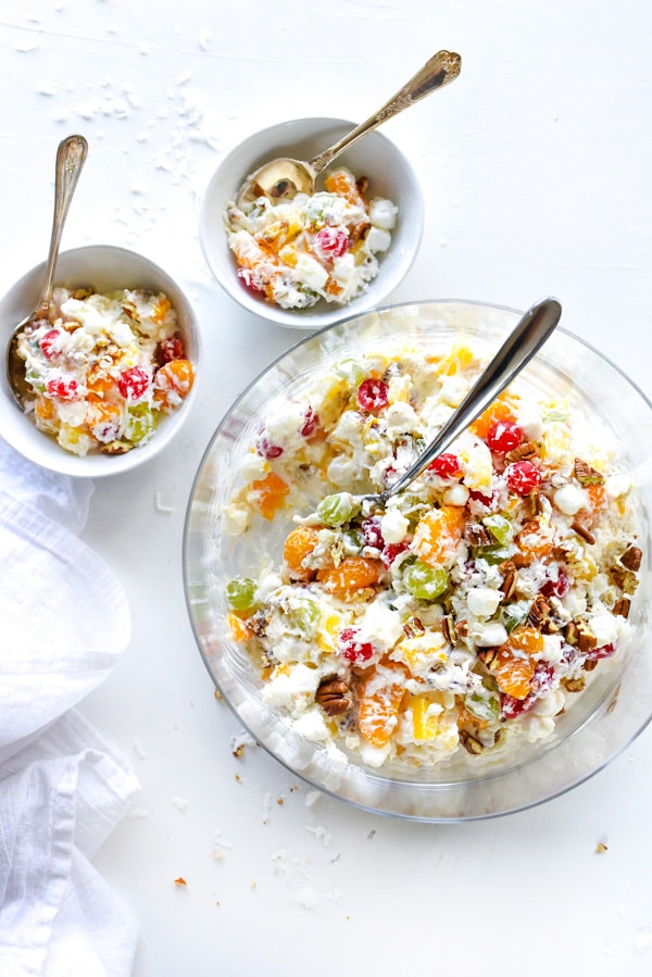 marshmallow fruit salad in large serving bowl and two smaller bowls