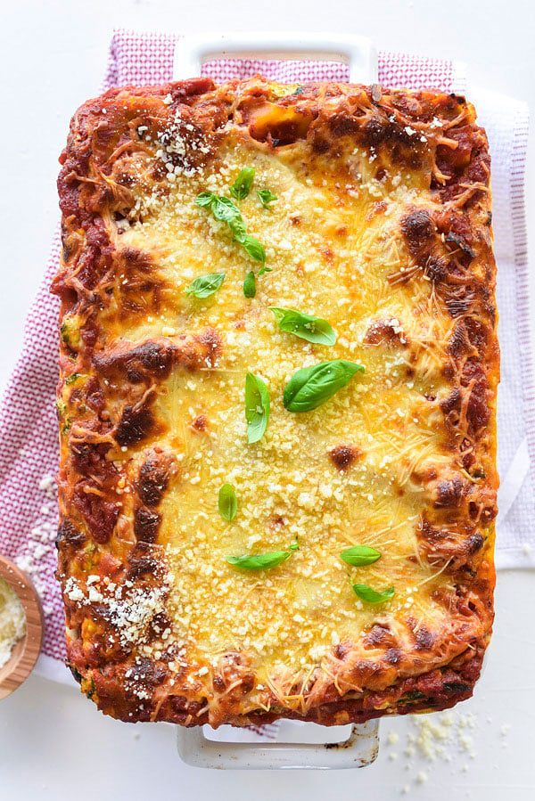vegetarian lasagna with cottage cheese in white baking dish