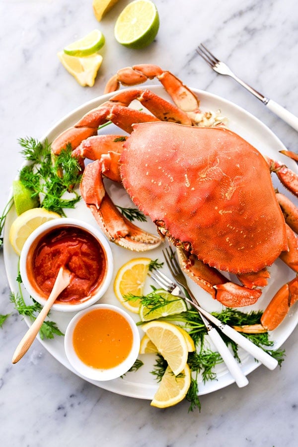 The Easiest Whole Dungeness Crab Recipe with Citrus Butter | #howtocook #boil #recipes #dinner #howtoeat foodiecrush.com