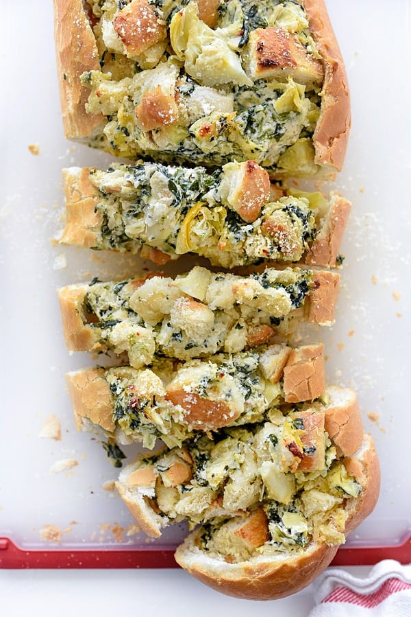 Spinach Artichoke Stuffed Bread | #stuffed #pullapart #dip #boat #creamcheese foodiecrush.com 