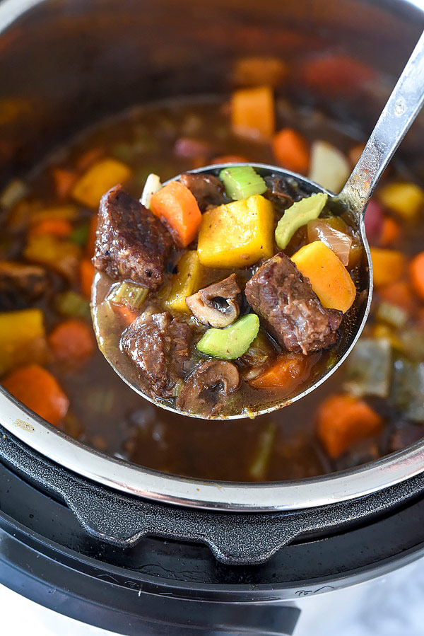 instant pot beef stew in ladle