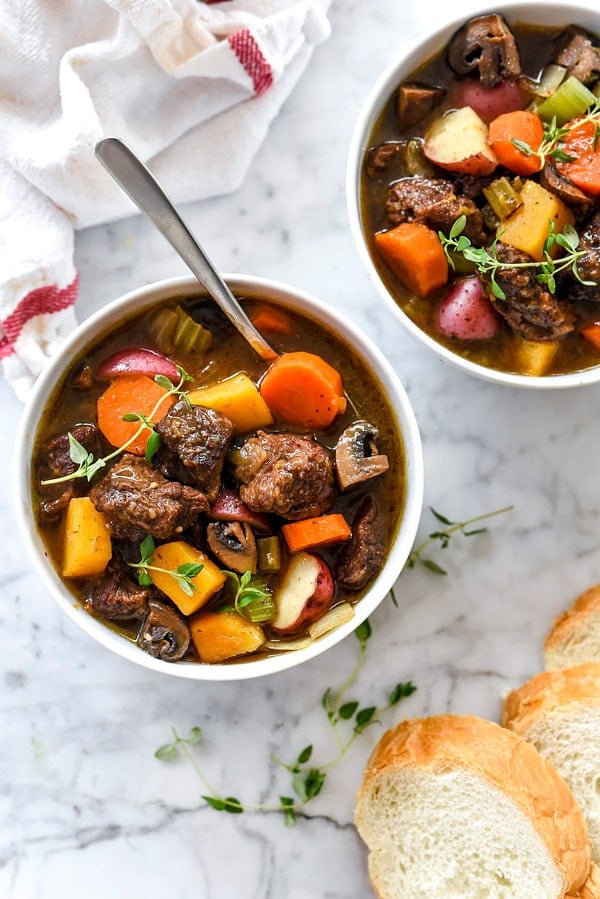 two servings of best beef stew in white bowls