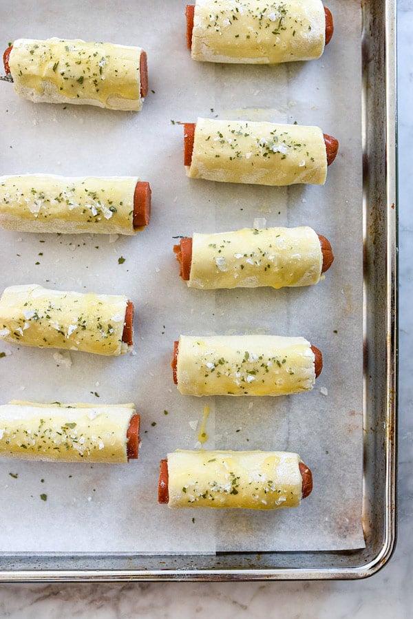 unbaked mini pigs in a blanket on baking tray