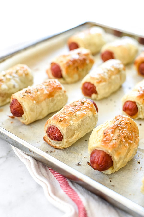 puff pastry pigs in a blanket on baking tray