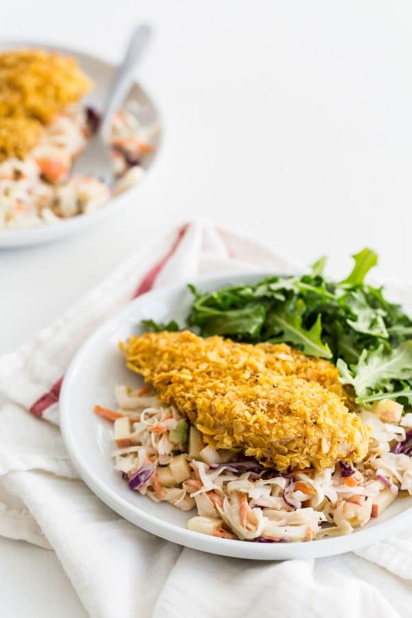 Cornflake Oven Fried Chicken with Honey Mustard Apple Slaw from andiemitchell.com on foodiecrush.com