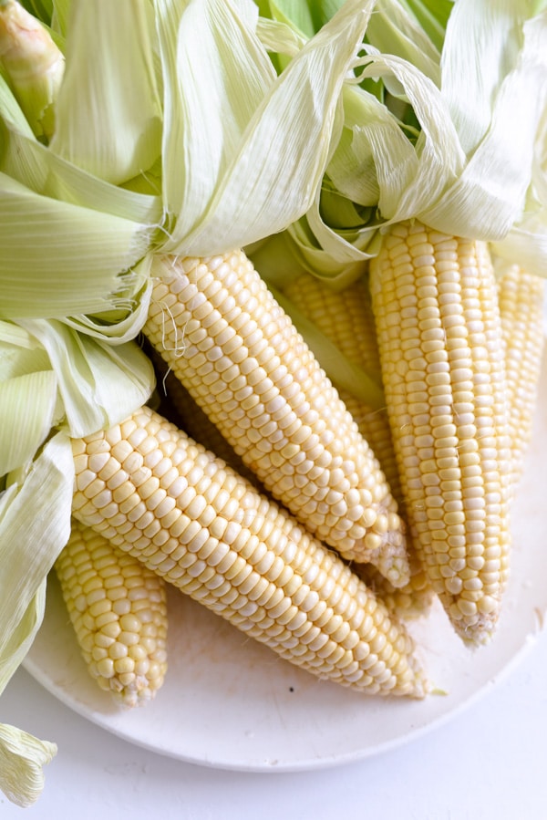 Corn Cobs in the husk for grilled sweet corn