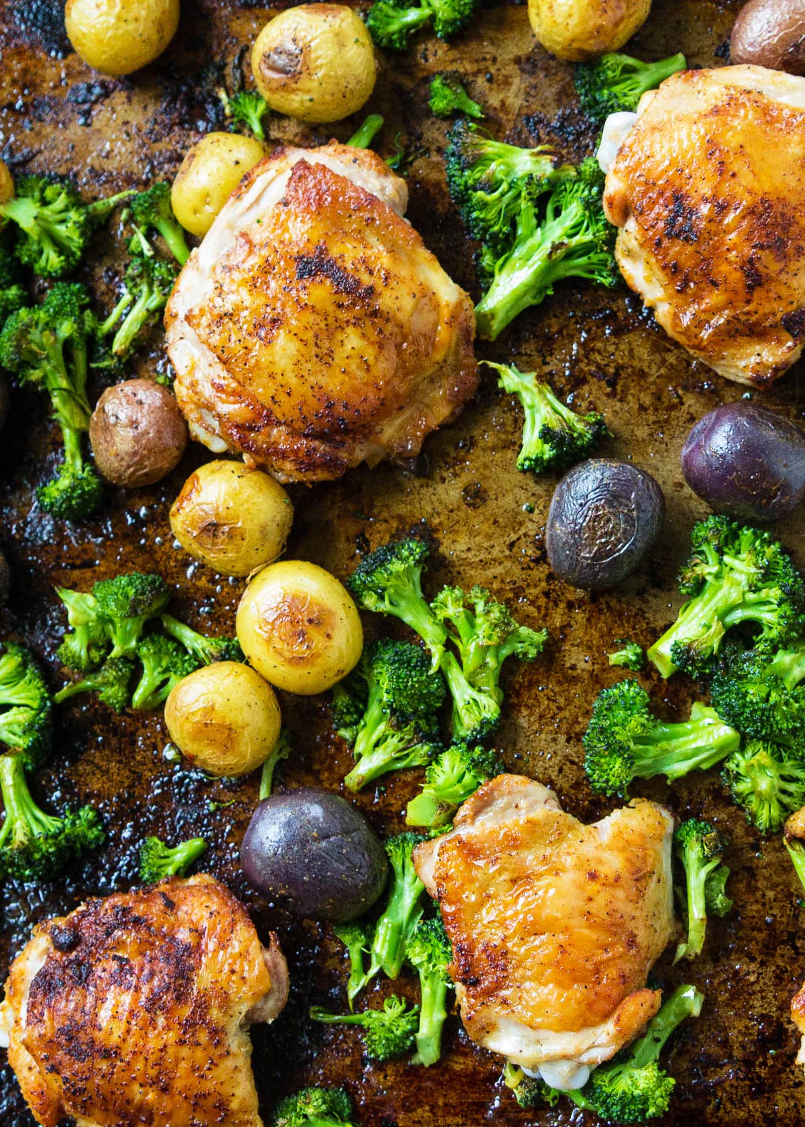 Sheet Pan Chicken with Roasted Broccoli and Potatoes from simplyrecipes.com on foodiecrush.com