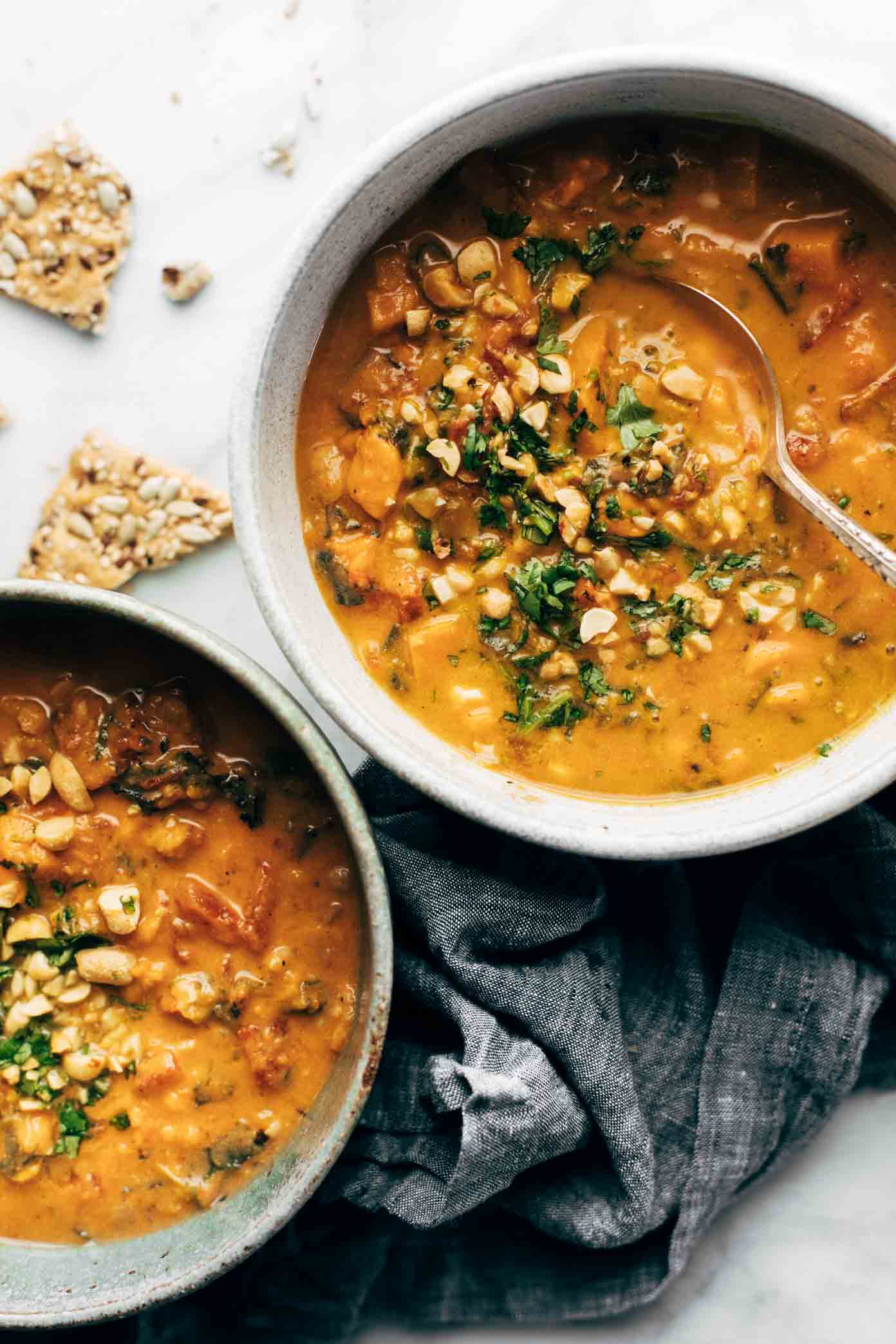 Spicy Peanut Soup with Sweet Potato + Kale from pinchofyum.com on foodiecrush.com