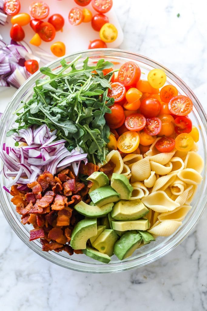 BLT pasta salad ingredients in glass bowl