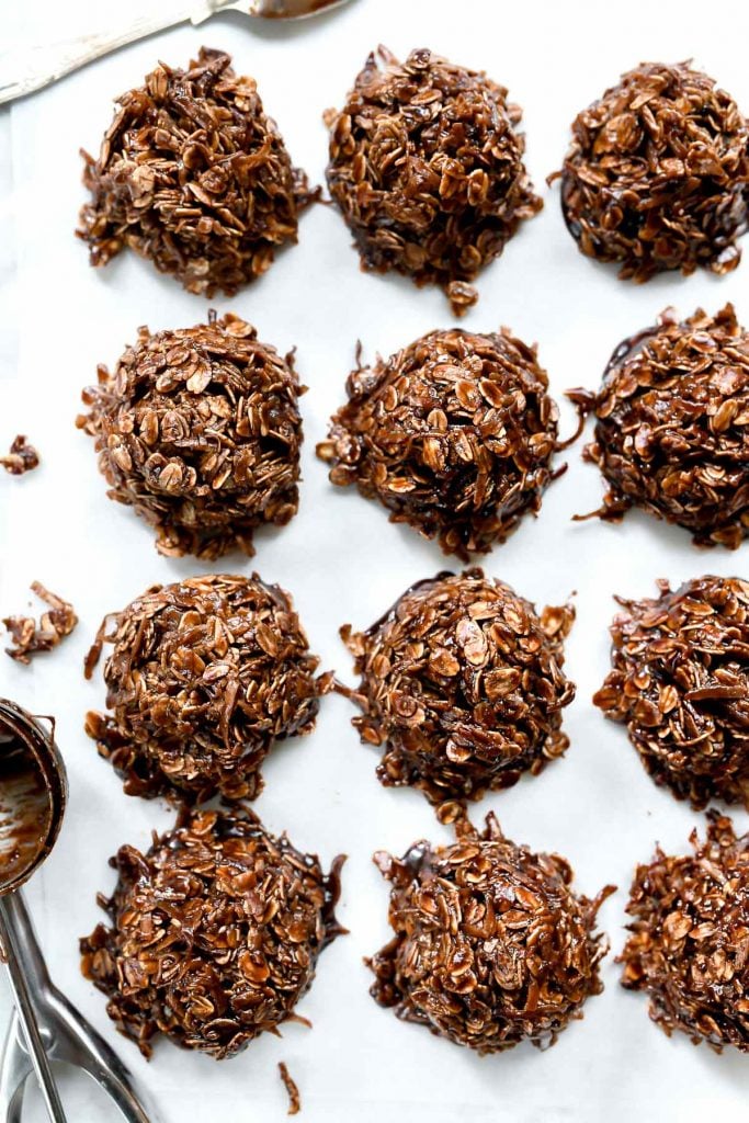 no bake chocolate oatmeal cookies with coconut on parchment paper