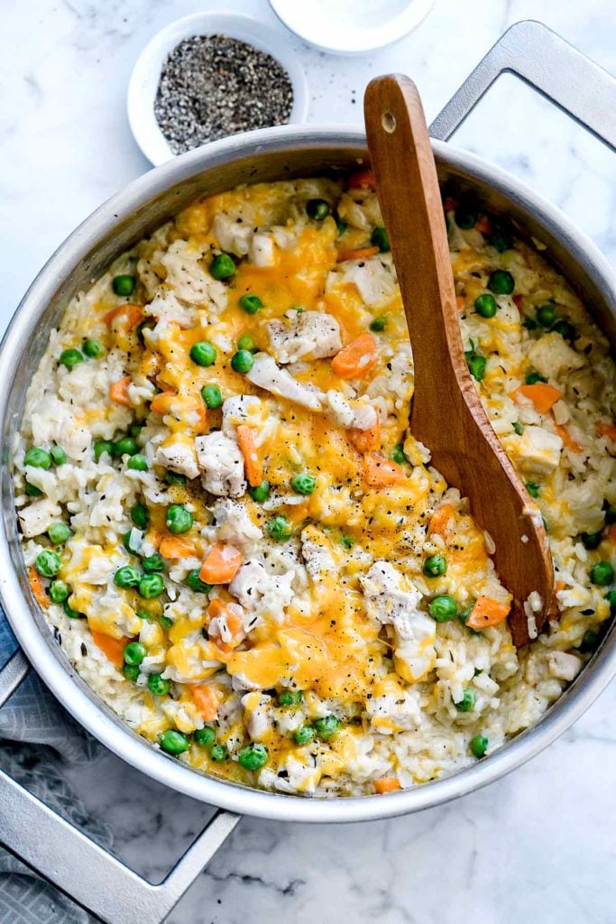 One Pot Chicken and Rice Casserole with wooden spoon 