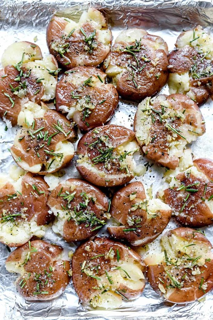 roasted smashed potatoes on foil-lined baking tray