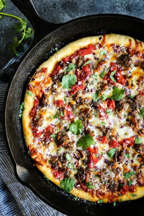 Skillet Pizza with Sausage and Chili Garlic Tomato Sauce from a Farmgirl's Dabbles | foodiecrush.com