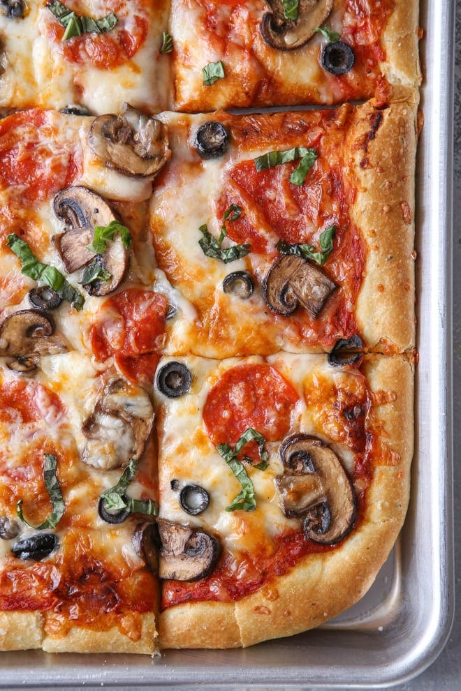 Pepperoni, Mushroom and Olive Sheet Pan Pizza from Completely Delicious on foodiecrush.com