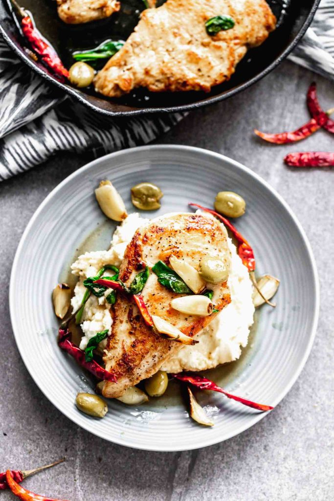 Chicken With Chiles, Olives, and Roasted Garlic from Cooking for Keeps on FoodieCrush.com