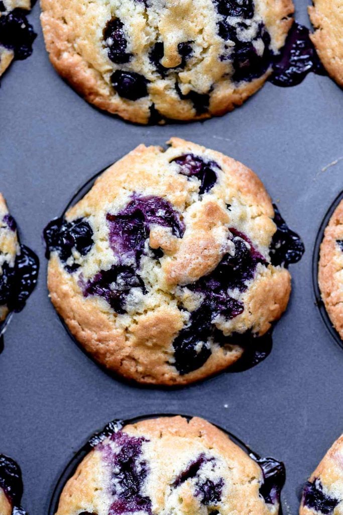 blueberry muffins in muffin tin