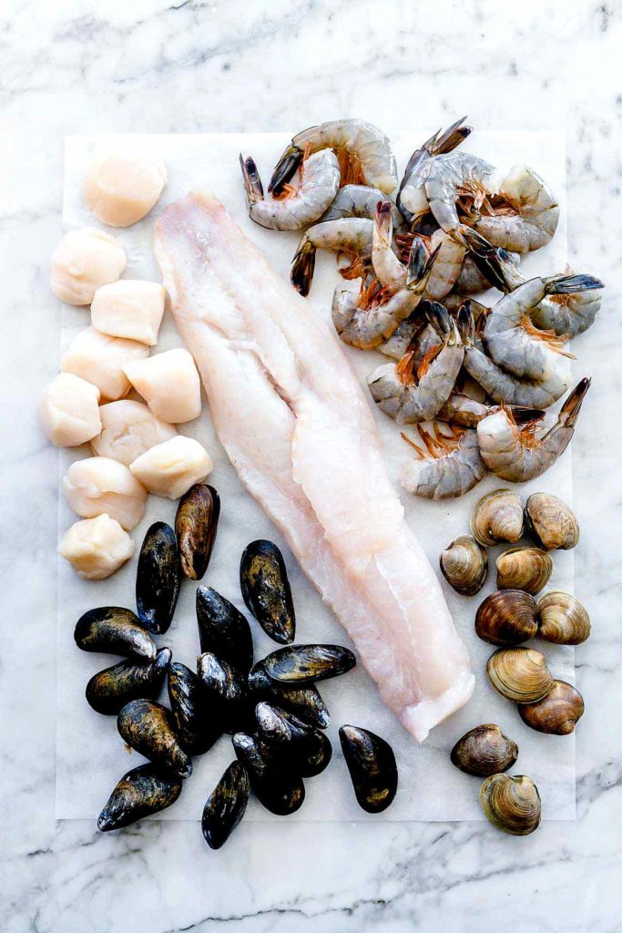 Ingredients for Cioppino Recipe Scallops Cod Mussels Shrimp Clams | foodiecrush.com #cioppino #seafood #easy #recipes