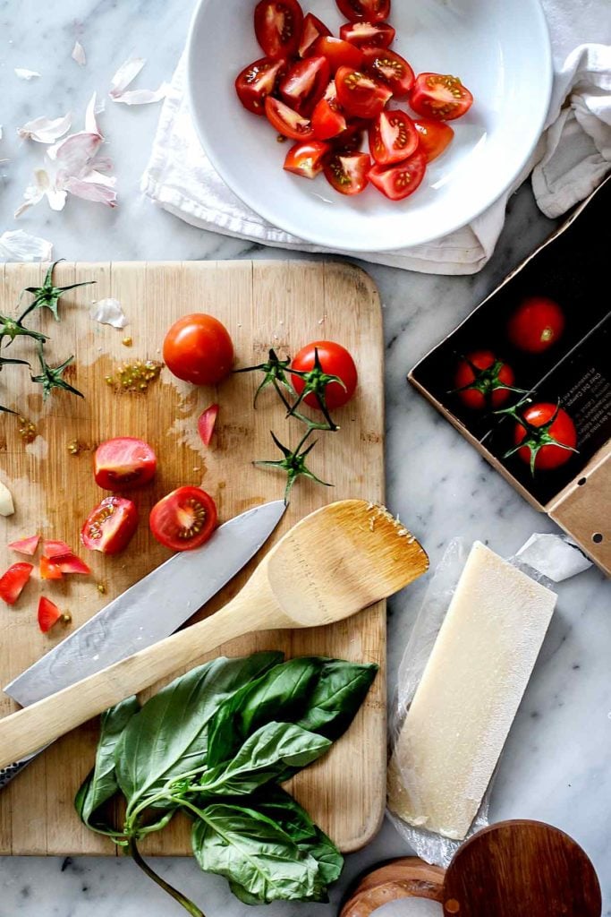 Fresh tomato sauce ingredients on a cutting board | foodiecrush.com