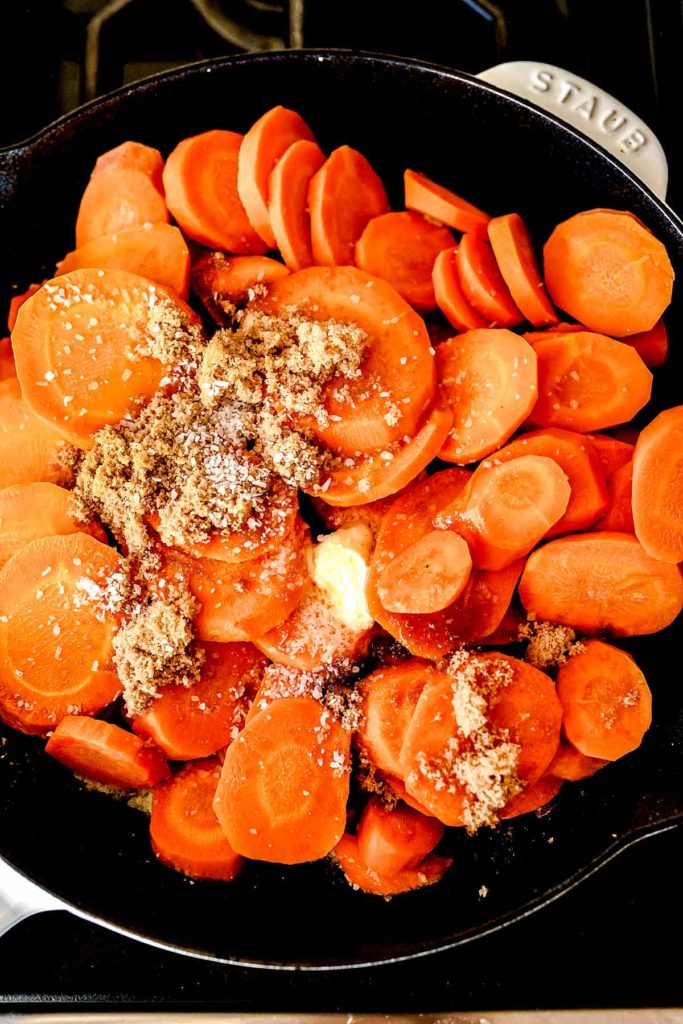 Glazed Carrots in a pan foodiecrush.com #carrots #sidedish #easy #brownsugar #recipe #stovetop