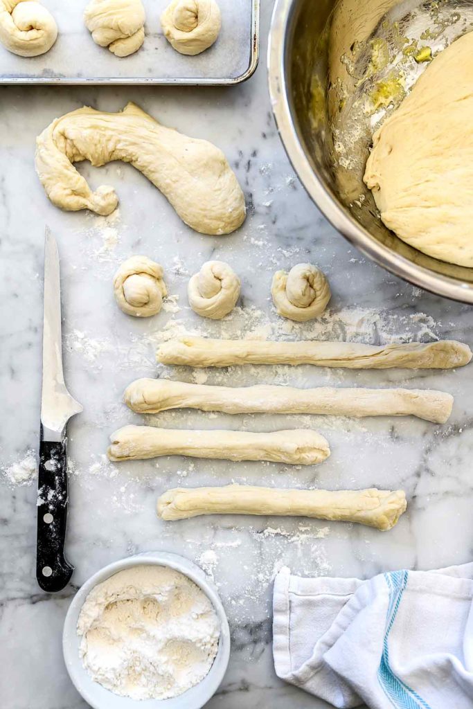 Pizza Dough Knots on baking sheet | foodiecrush.com #garlic #rolls #knots #recipes