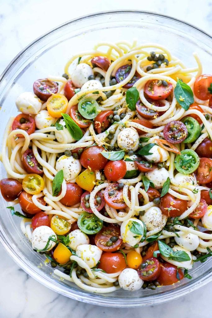 Caprese Pasta Salad with Garlic Marinated Tomatoes from foodiecrush.com on foodiecrush.com