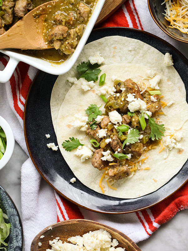 tortillas topped with slow cooker green chili