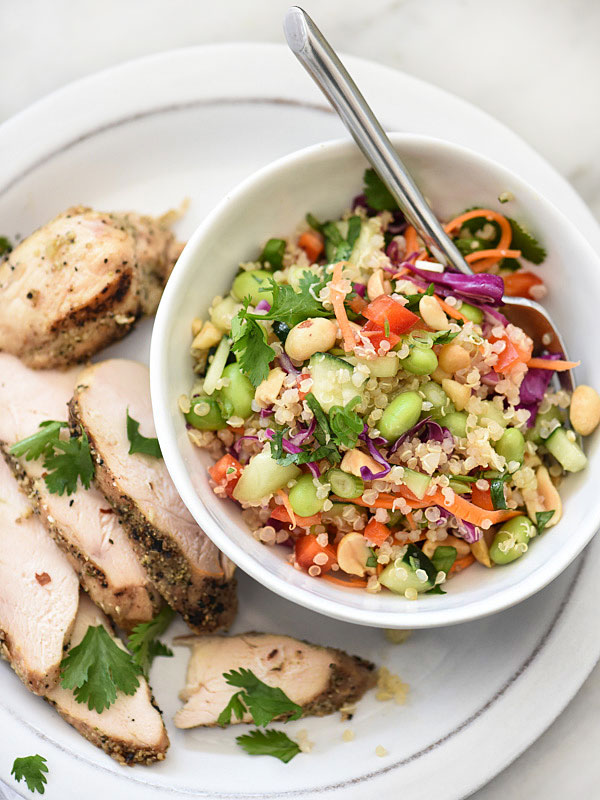 thai quinoa salad on plate with chicken breast