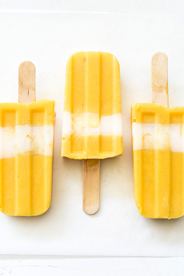 Creamy Mango Popsicles foodiecrush.com 