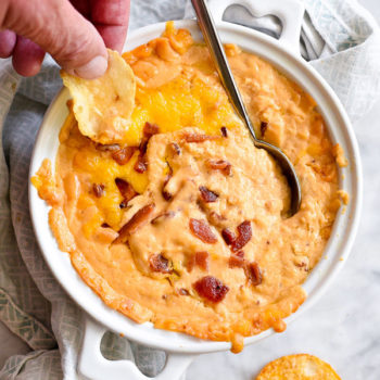 DIP IN! Bacon Beer Cheese Dip any man or woman will love foodiecrush.com #cheese #beer #dip #bacon #football #tailgating