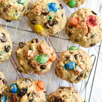 Loaded Monster Cookies pack in all the flavors with whole wheat pastry flour, nuts, oatmeal, popcorn, and coconut. And don't forget the chocolate for a healthy twist on dessert | foodiecrush.com