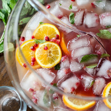Pomegranate and Orange Champagne Punch is a fancy looking but totally easy punch for a crowd. | foodiecrush.com