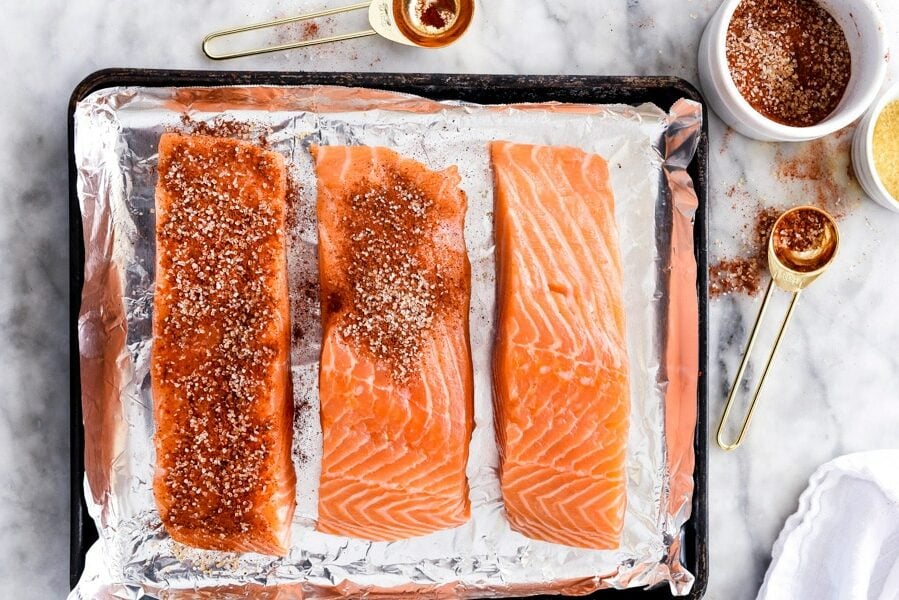 uncooked maple syrup salmon on baking tray