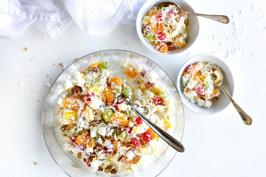 marshmallow fruit salad in large serving bowl and two smaller bowls